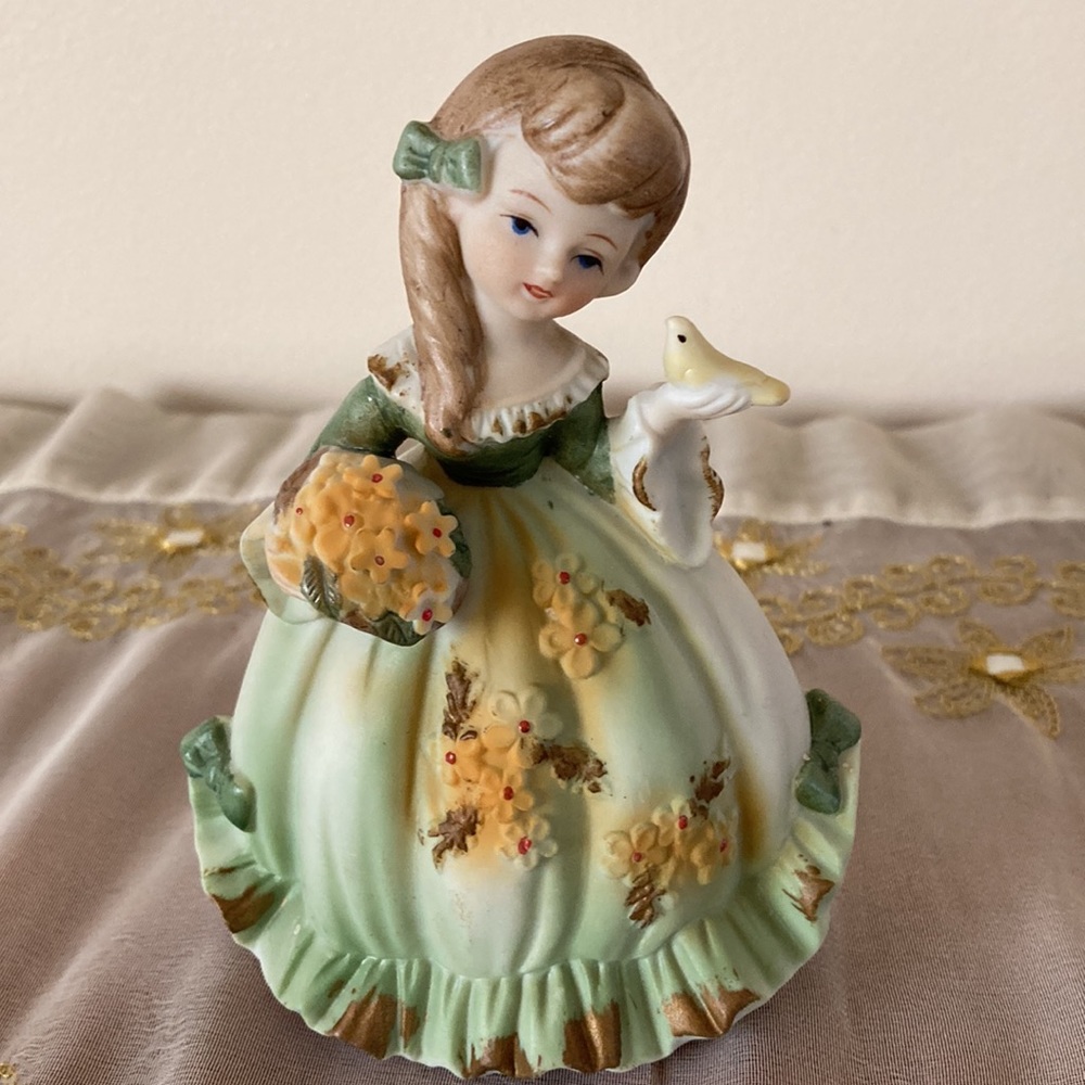 Lefton China Hand Painted Bisque Porcelain Girl holding Bird and Flower Basket